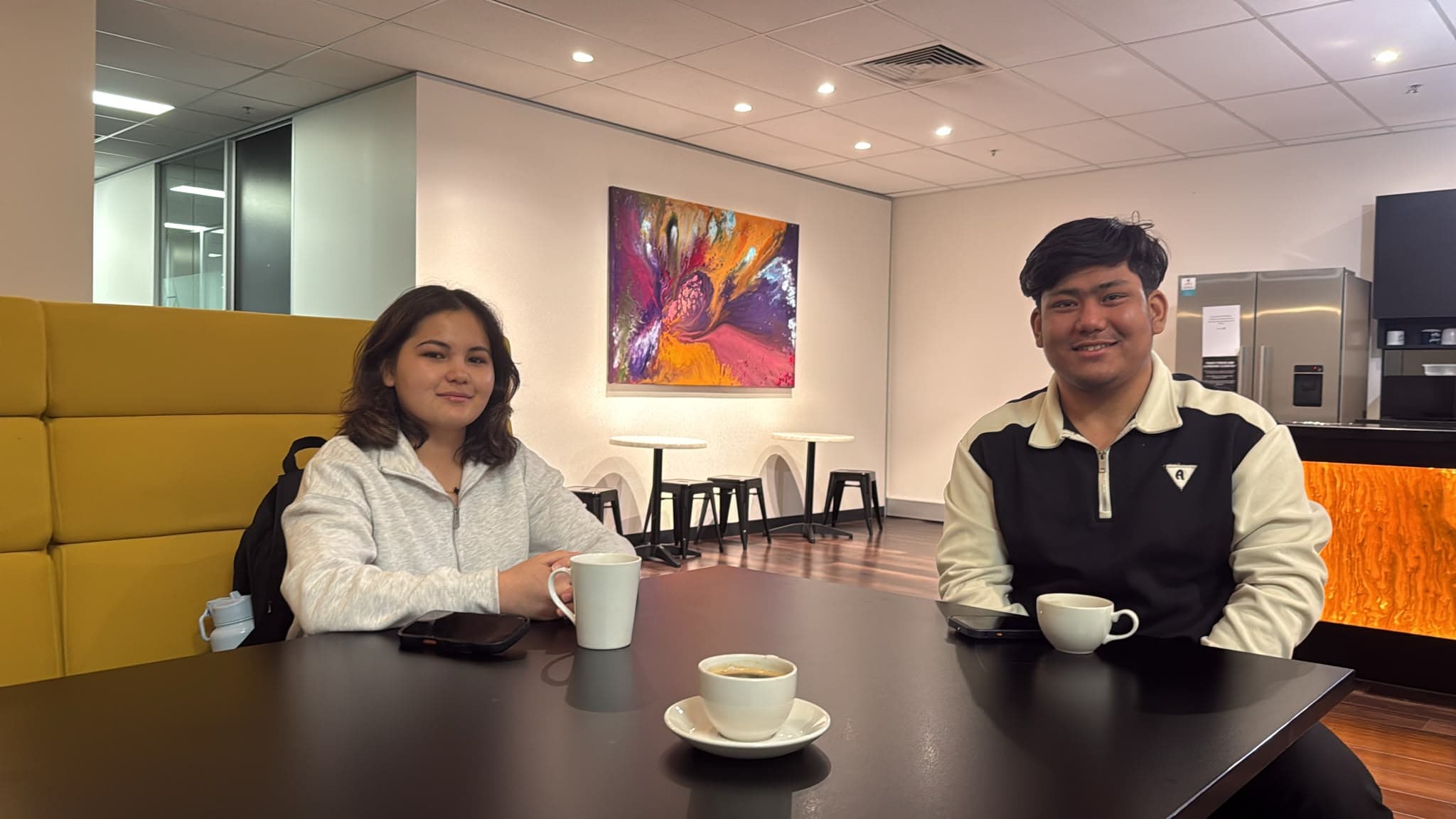 Reza and Shaman sharing a relaxed moment together over coffee